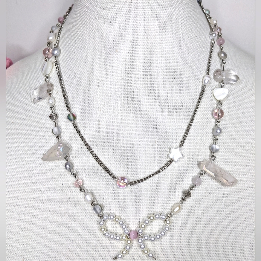 Necklace with pink beads,chain and pearl bow made out of wire. Handmade by me.